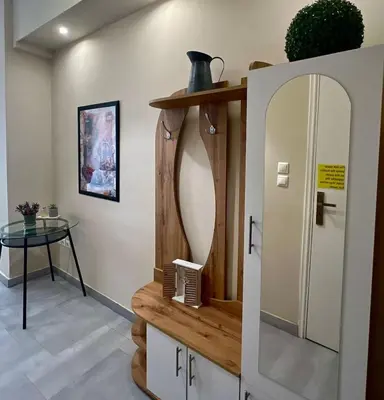 a dressing room with a mirror and a table at Monastiraki 103 SuperHost Hub in Athens