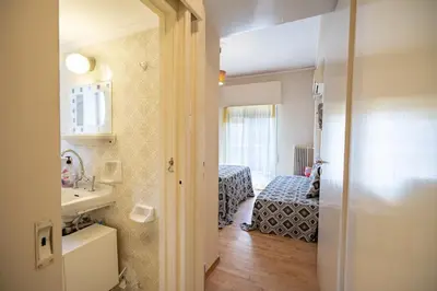 a small room with a sink and a bedroom at Acropolis Athens 1 bedroom 4 pers apt by MPS in Athens