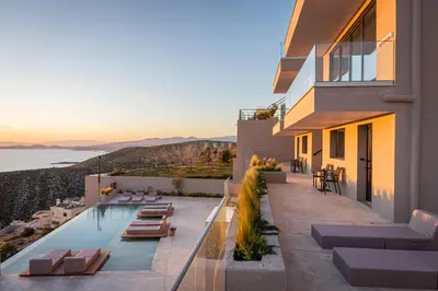 a view of a building with a swimming pool at Saronida Hills in Saronida
