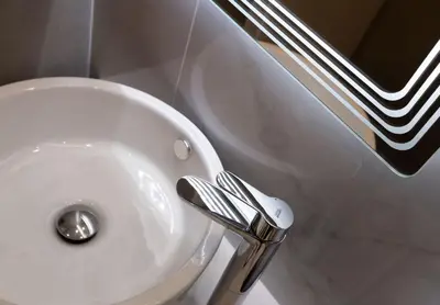 a bathroom with a sink and a toilet and a sink at Iconic Athens Suites in Athens