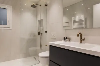 a bathroom with a sink and a toilet and a shower at Spectacular 3BR Apartment in Pangrati by UPSTREET in Athens