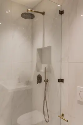 a bathroom with a shower with a glass door at Spectacular 3BR Apartment in Pangrati by UPSTREET in Athens
