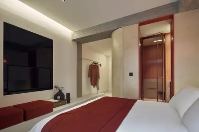 a bedroom with a large bed and a television at The Newel Metaxourgeio by Athens Stay in Athens