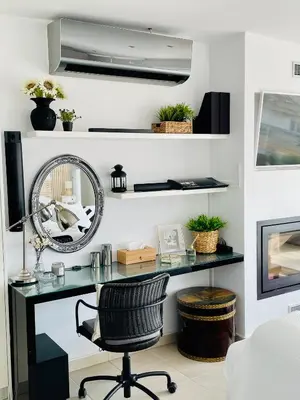 a desk with a mirror and a chair in a room at Luxury Penthouse Studio with Sea View, Palaio Faliro in Athens