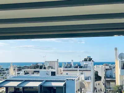a view of a city from a building at Luxury Penthouse Studio with Sea View, Palaio Faliro in Athens