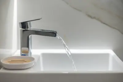 a sink with water coming out of a faucet at SYNTAGMA MINI in Athens