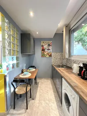 a kitchen with a table and a sink at Historic Center getaway 10'walk to Acropolis hill in Athens