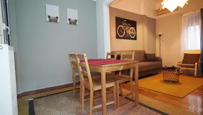 a living room with a table and a couch at Athens City Themis 14 in Athens
