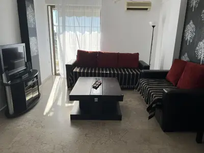 a living room with a couch and a coffee table at Kali - Thea Spacious 2 BR Penthouse, City View in Athens