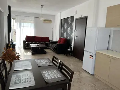 a kitchen and living room with a table and a refrigerator at Kali - Thea Spacious 2 BR Penthouse, City View in Athens