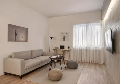 a living room with a couch and a table at Cute n Comfort Luxury Condo in Kolonaki in Athens