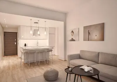 a living room with a couch and a kitchen at Cute n Comfort Luxury Condo in Kolonaki in Athens