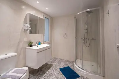 a bathroom with a shower and a sink and a toilet at Exclusive apartment in the heart of Athens in Athens