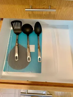 three utensils in a plastic container with forks at Cute Nikis Apartment VIPGreece in Athens