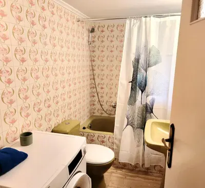 a bathroom with a toilet and a shower curtain at Cute Nikis Apartment VIPGreece in Athens