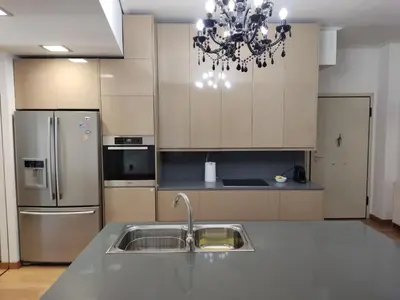 a kitchen with a sink and a refrigerator at Luxury Living Athens by YHA in Athens