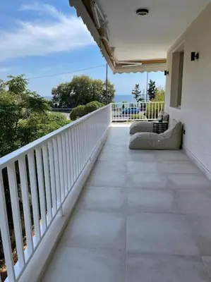 a balcony of a house with a view of the ocean at Lagonisi Luxury apartment 2 by the sea in Lagonissi