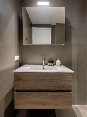a bathroom with a sink and a mirror at Christiana's lovely apartment in Psyri, Athens in Athens