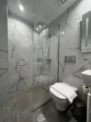 a bathroom with a shower and a toilet and a sink at Studio MV in the center of Athens - Secured area in Athens