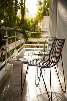 a pair of chairs and a table on a patio at Phaedrus Living Kolonaki Crown Residences in Athens