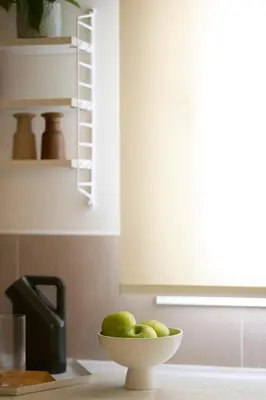 a bowl of pears on a counter in a kitchen at Phaedrus Living Kolonaki Crown Residences in Athens