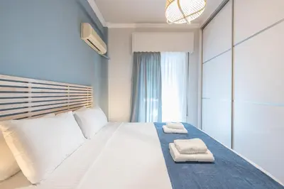 a bedroom with a bed with two towels on it at Athens City Getaway in Athens