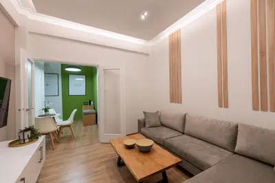 a living room with a couch and a table at MEDLUXE COZY APARTMENT! in Athens