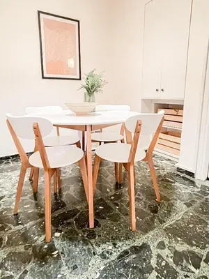 a white dining room table and chairs in a room at Boho Chic 2BR Apartment in the Center of Athens in Athens