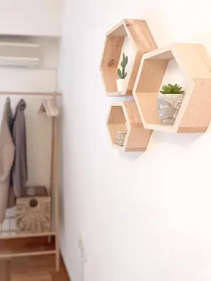 a shelf on a wall with potted plants on it at Boho Chic 2BR Apartment in the Center of Athens in Athens
