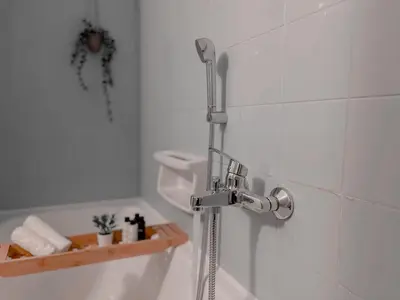a shower in a bathroom with a shower head at Boho Chic 2BR Apartment in the Center of Athens in Athens