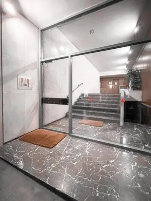 a room with a glass door and some stairs at Boho Chic 2BR Apartment in the Center of Athens in Athens