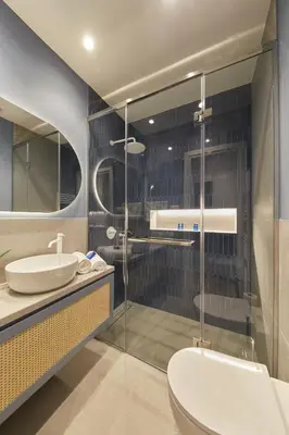 a bathroom with a shower and a sink and a toilet at Artemis Suite at Acropolis Historic Center in Athens