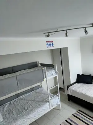 a room with two bunk beds and a bed at Friends Apartment Syngrou in Athens