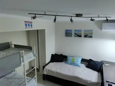 a bedroom with two bunk beds in a room at Friends Apartment Syngrou in Athens