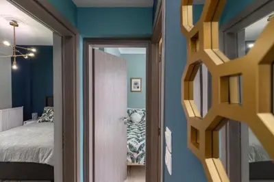 a room with a bed and a door to a bedroom at Artistic apt in vibrant Gazi with large terrace by GHH in Athens