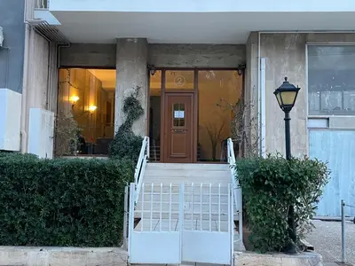a front door of a house with a white staircase at Athens Edem Beach Penthouse, panoramic sea view in Athens