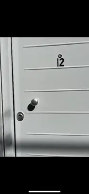 a white door with the number twelve on it at Boho Privet Flat in Athens in Athens