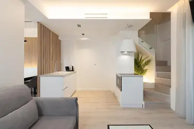 a living room with a couch and a table at Incanto Boutique Suites - Neos Kosmos in Athens