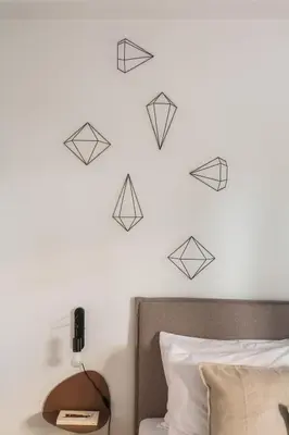 a bedroom with a wall with black origami birds at Groovy 2BR Apartment in Koukaki by UPSTREET in Athens