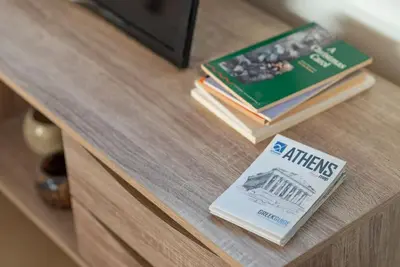 a table with two books on top of a cabinet at Studio Acropolis Star in Athens