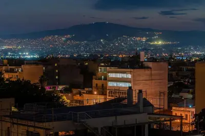 a view of a city at night at Studio Acropolis Star in Athens