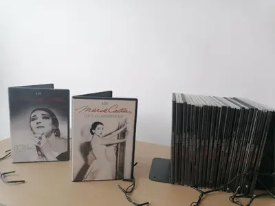three books sitting on top of a table at The Lop Athens Holidays Luxury Suites in Athens