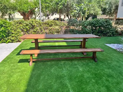 a wooden picnic table sitting on top of green grass at Sia Mare in Kalívia Thorikoú