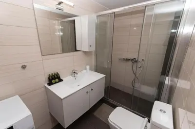 a bathroom with a shower and a sink and a toilet at Comfy flat located in Piraeus (E7) in Piraeus