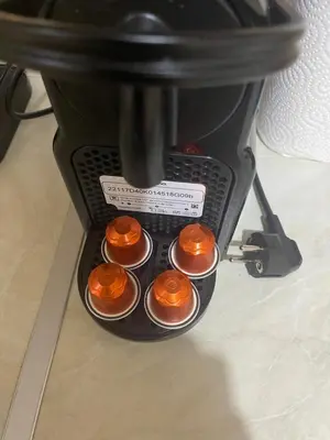 a group of orange cupcakes in a coffee maker at Athens Spirit Apartment in Athens
