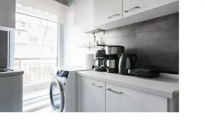 a kitchen with a counter top with a coffee maker at Central faliro Apartment near to marina in Athens