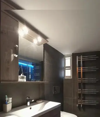 a bathroom with a sink and a mirror at Central faliro Apartment near to marina in Athens