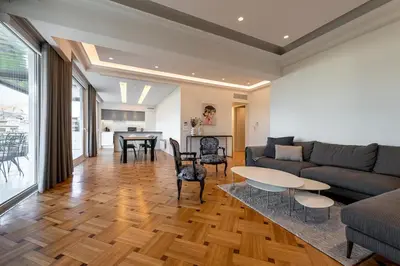 a living room with a couch and a table at Phaedrus Living City Center Luxury Flat Neos Kosmos in Athens