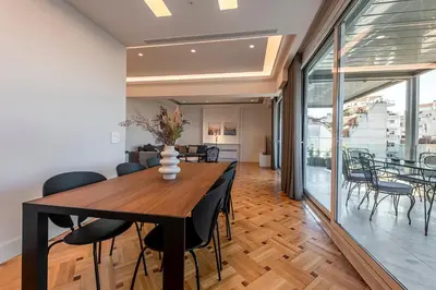 a dining room with a table and chairs at Phaedrus Living City Center Luxury Flat Neos Kosmos in Athens