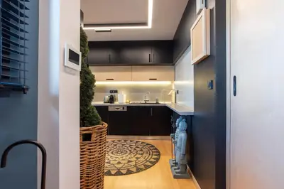 a kitchen with a sink and a counter top at Athens Skyline Loft in Athens